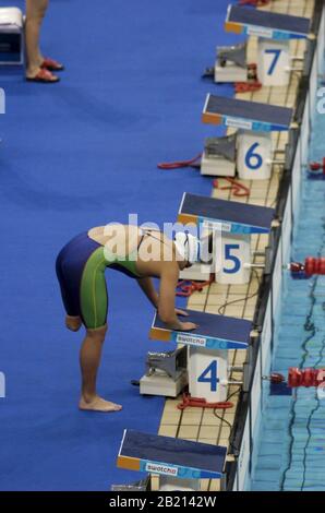 Athens, Greece  18SEP04:  South Africa's Natalie du Toit balances on the starting block before the women's 100-meter butterfly S9 category at the Athens Paralympic swimming. Du Toit set a world record in the event at 1:07.69 clocking. ©Bob Daemmrich Stock Photo