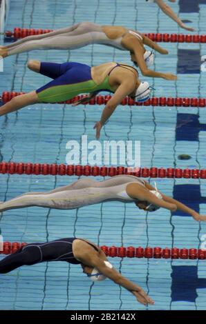 Athens, Greece  18SEP04:  South Africa's Natalie du Toit takes off in the women's 100-meter butterfly S9 category at the Athens Paralympic swimming. Du Toit set a world record in the event at 1:07.69 clocking.  ©Bob Daemmrich Stock Photo