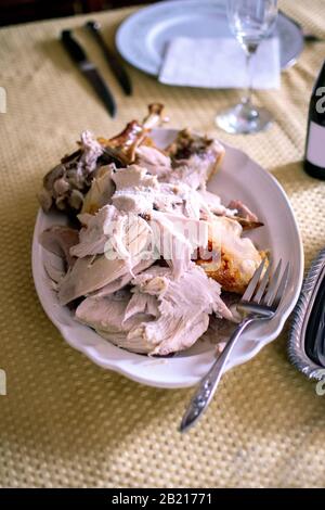 Platter holds a roasted turkey, cut up for Thanksgiving day dinner sharing Stock Photo