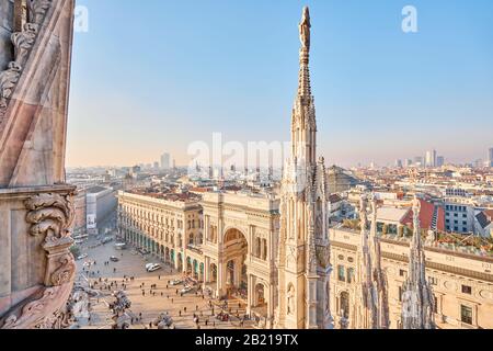 Milan, Italy - January 21 2019: Amazing view of old Gothic spires. Milan Cathedral roof on sunny day, Italy. Milan Cathedral or Duomo di Milano is top Stock Photo