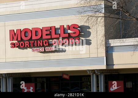 A logo sign outside of a Modell's Sporting Goods retail store location in Baltimore, Maryland on February 21, 2020. Stock Photo