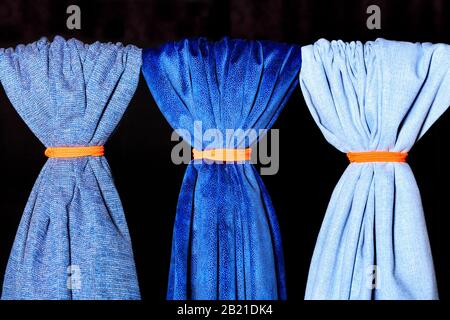 Textiles of various blue shades and textures, technology, style and beauty concept in clothes and interior. Stock Photo