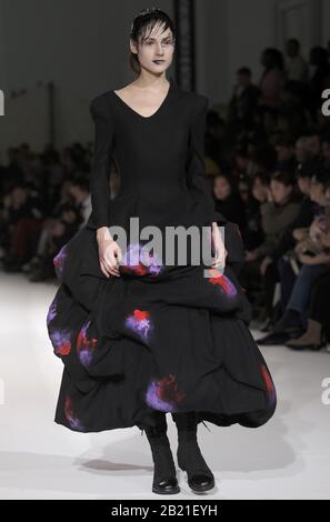 Paris, France. 28th Feb, 2020. A model takes to the catwalk during Yohji Yamamoto's show as part of the Fall-Winter 2020 Fashion Week presentations in Paris on Friday, February 28, 2020. Photo by Eco Clement/UPI Credit: UPI/Alamy Live News Stock Photo