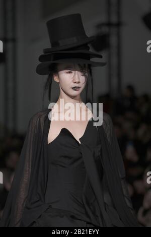 Paris, France. 28th Feb, 2020. A model takes to the catwalk during Yohji Yamamoto's show as part of the Fall-Winter 2020 Fashion Week presentations in Paris on Friday, February 28, 2020. Photo by Eco Clement/UPI Credit: UPI/Alamy Live News Stock Photo