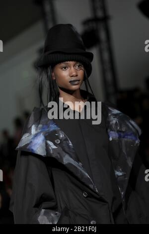 Paris, France. 28th Feb, 2020. A model takes to the catwalk during Yohji Yamamoto's show as part of the Fall-Winter 2020 Fashion Week presentations in Paris on Friday, February 28, 2020. Photo by Eco Clement/UPI Credit: UPI/Alamy Live News Stock Photo