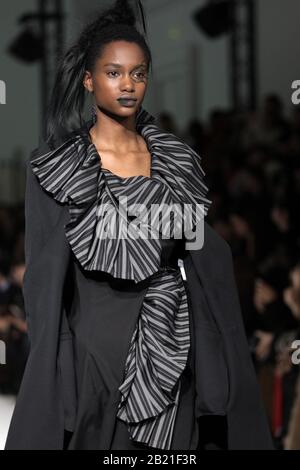 Paris, France. 28th Feb, 2020. A model takes to the catwalk during Yohji Yamamoto's show as part of the Fall-Winter 2020 Fashion Week presentations in Paris on Friday, February 28, 2020. Photo by Eco Clement/UPI Credit: UPI/Alamy Live News Stock Photo