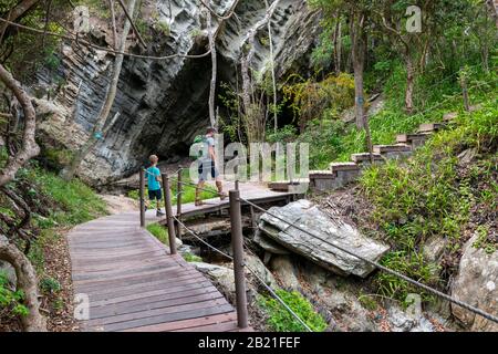 Father and son on hike through magnificent scenery at Storms River Tsitsikamma National Park, Garden Route, near Port Elizabeth,South Africa Stock Photo