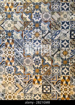 Multicoloured tile with different patterns. Blue, white, brown and yellow colours. Spanish style Stock Photo
