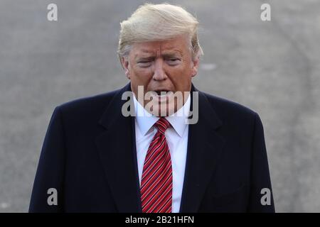 Washington, USA. 29th Feb, 2020. President Donald Trump speaks to the media prior to his departure from the South Lawn of the White House in Washington, DC, on February 28, 2020. - Trump is traveling to North Charleston, South Carolina for a MAGA rally. (Photo by Oliver Contreras/SIPA USA) Credit: Sipa USA/Alamy Live News Stock Photo