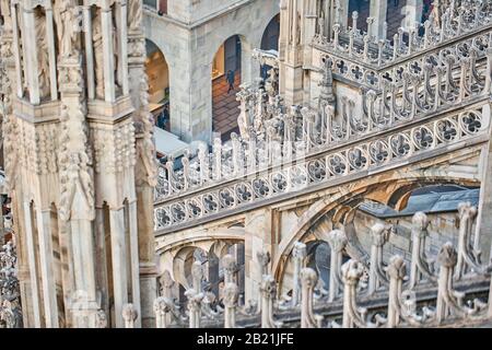 Amazing view of old Gothic spires. Milan Cathedral roof on sunny day, Italy. Milan Cathedral or Duomo di Milano is top tourist attraction of Milan. Stock Photo