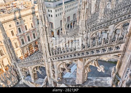 Amazing view of old Gothic spires. Milan Cathedral roof on sunny day, Italy. Milan Cathedral or Duomo di Milano is top tourist attraction of Milan. Stock Photo