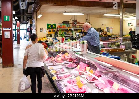 Florence, Italy - August 30, 2018: Firenze mercato centrale market with stall counter and raw meat behind glass on display in shop butcher Stock Photo