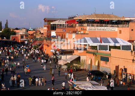 People walking at famous Marrakesh square Jema el Fna in Marrakesh, Morocco. The square is part of the UNESCO World Heritage. Stock Photo