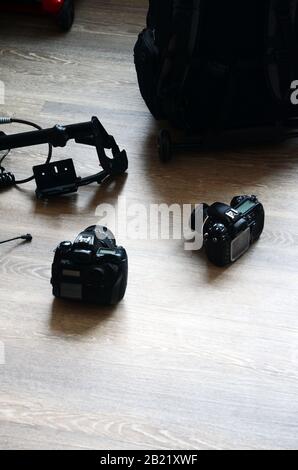 PHOTO SHOOT: Photography equipment sits on the floor of an apartment. Stock Photo