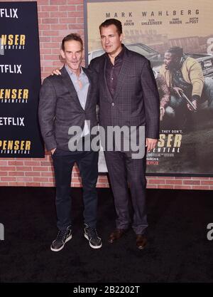 WESTWOOD, CA - FEBRUARY 27: Peter Berg (L) and Scott Stuber attend the Premiere of Netflix's 'Spenser Confidential' at Regency Village Theatre on February 27, 2020 in Westwood, California. Stock Photo