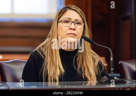 New York, New York, USA. 28th Feb, 2020. Carmen Cruz, the mother of Erick Diaz-Cruz, the 26-year-old man who was shot in the face by ICE agents on February 6, 2020, testifies at the Combating Deceptive Immigration Enforcement Practices Act of 2019 hearing at City Hall on February 28, 2020. Diaz Cruz was shot in the face by ICE agents when he tried to intervene in the deportation arrest of Gaspar Avendano Hernandez, his mother's longtime partner. (Photo by Gabriele Holtermann-Gorden/Sipa USA) Credit: Sipa USA/Alamy Live News Stock Photo