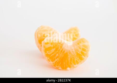 Pair of mandarin orange segments isolated on white background Stock Photo