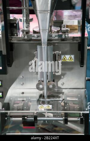 Automatic vertical food sealing and packing machine for food industry Stock Photo