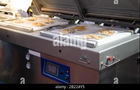 Heat sealing vacuum machine for food packaging Stock Photo - Alamy