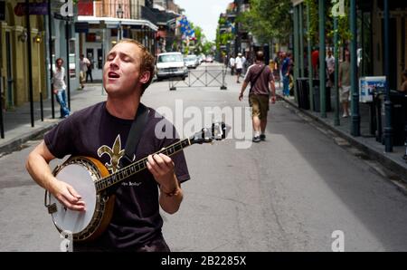 New Orleans, Louisiana, United States - July 17 2009: Jazz Banjo Player Playing Outdoors on Bourbon Street in the French Quarter. Stock Photo
