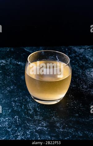 Homemade Traditional Healthy Fermented Raw Kombucha Tea with Mint Leaves in Glass Ready to Drink. Organic Beverage. Stock Photo