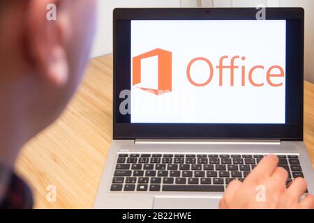 Office 365 is used by a man on the laptop. Microsoft customer used computer software. New product is tested by IT specialist. San Francisco, February Stock Photo