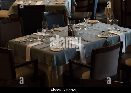 top view or view from above of dining tables set or laid in a restaurant or hotel dining room with no people Stock Photo