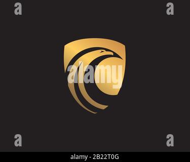 gold eagle hawk head negative space inside a golden shield Stock Vector