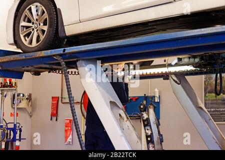 Umea, Norrland Sweden - February 15, 2020: car mechanic examines the brakes Stock Photo