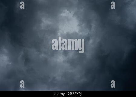 Dark black clouds in the sky, Stormy rain clouds background. Stock Photo