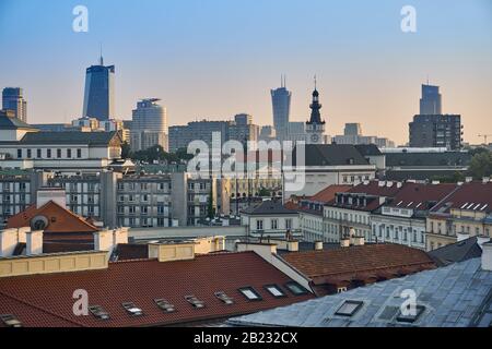 Warsaw, Poland - August 11, 2017: Beautiful panoramic view over the roofs of the Old Town to the Center of Warsaw, the Palace of culture and science ( Stock Photo