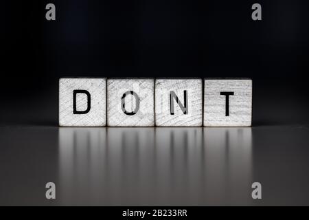 the word dont as Concept on wooden cubes, business Stock Photo
