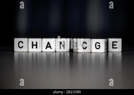 the words change an chance as Concept on wooden cubes, business Stock Photo