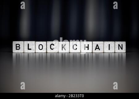 the word blockchain as Concept on wooden cubes, business Stock Photo