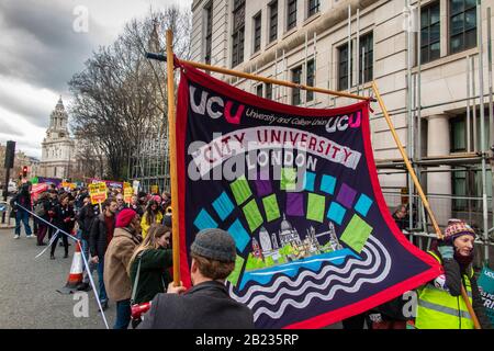 26th February 2020 - Protestors march through the City of London by St Paul's Cathedral on the 'March for Education', standing up top City 'fat cats' Stock Photo