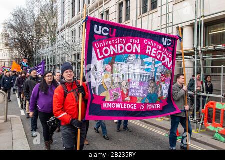 26th February 2020 - Protestors march through the City of London by St Paul's Cathedral on the 'March for Education', standing up top City 'fat cats' Stock Photo