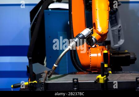 Automatic robotic arm for metal welding operations. Stock Photo