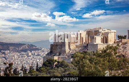 Athens, Greece. Acropolis propylaea propylea or propylaia entrance gateway and monument Agrippa pedestal, view from Philopappos Hill. Stock Photo