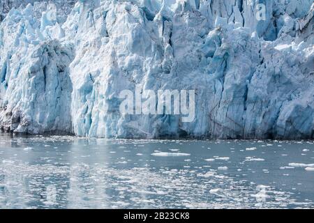 Alaska, USA: Close up view of Surprise Glacier in Prince William Sound (Gulf of Alaska) with reflections on ice lake Stock Photo