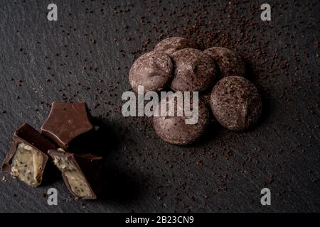 Homemade coffee flavored Belgian chocolates on dark background Stock Photo