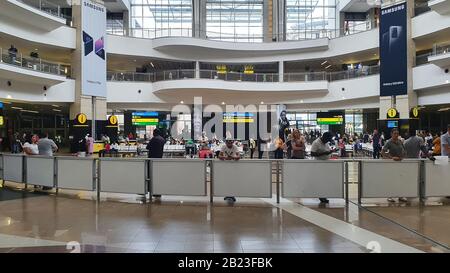 Johannesburg, South Africa - 18 Feb 2020: The ariport in Johannesburg in South Africa where people are busy moving on, arrival hall. Stock Photo