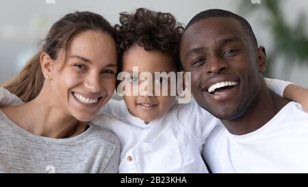 Head shot portrait smiling African American mother, father and son Stock Photo