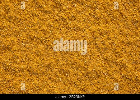 Ground Curry (Madras Curry) texture, full frame background. Used as a spice in cuisines all over the world. Stock Photo