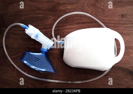 top view of a nebulizer - a drug delivery device used to administer medication in the form of a mist inhaled into the lungs. Nebulizers are used for t Stock Photo