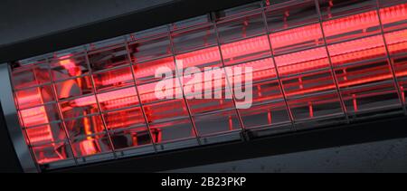 a switched on infrared heater on a house wall Stock Photo