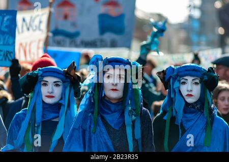 Glasgow, Scotland, UK. 29th February, 2020. The Blue Rebels leading the Blue Wave protest by the environmental campaign group Extinction Rebellion (XR) which saw activists  dressed in blue and green to represent the rising sea levels and flooding caused by increasing global temperatures and climate change. Credit: Skully/Alamy Live News Stock Photo