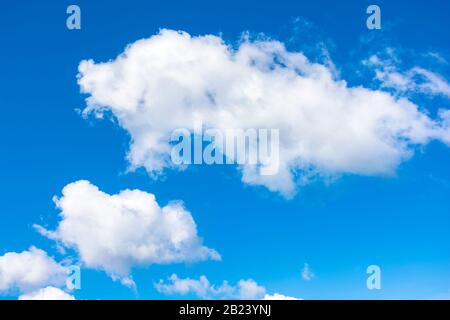 gorgeous cloudscape in springtime. weather background with dynamic cloud arrangement on a blue sky. sunny and windy day, good weather forecast concept Stock Photo