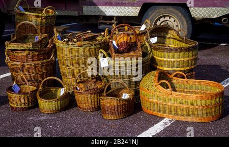 Traditional hand made wicker baskets made from willow  for sale at a country market Stock Photo
