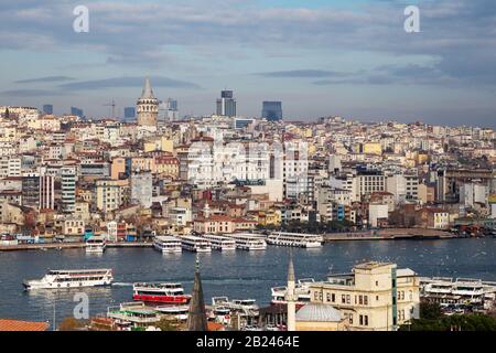 Istanbul / Turkey - 01/20/2019: View of Cityscape with Galata Tower and Golden Horn from garden of the Suleymaniye Mosque. Stock Photo