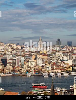 Istanbul / Turkey - 01/20/2019: View of Cityscape with Galata Tower and Golden Horn from garden of the Suleymaniye Mosque. Stock Photo